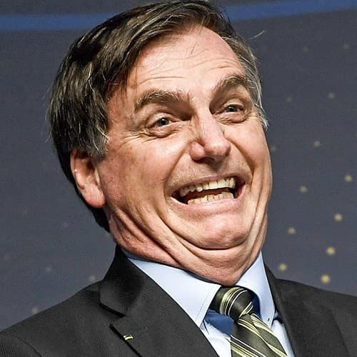 Genocida rindo com cara de idiota